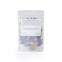 A bag of blue lotus flowers from Herba Rosa with the back label showing, all in front of a white background